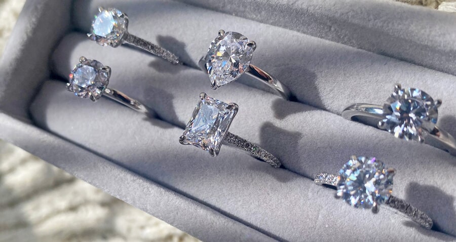 Grey tray of diamond engagement rings